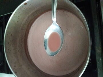 Pink kashmiri chai in spoon