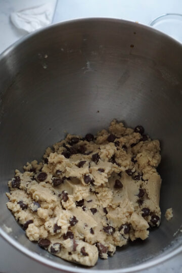 Chocolate chip cookie dough in gray bowl