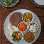 Gujarati thali on a wooden table.