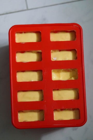 mango popsicle in molds