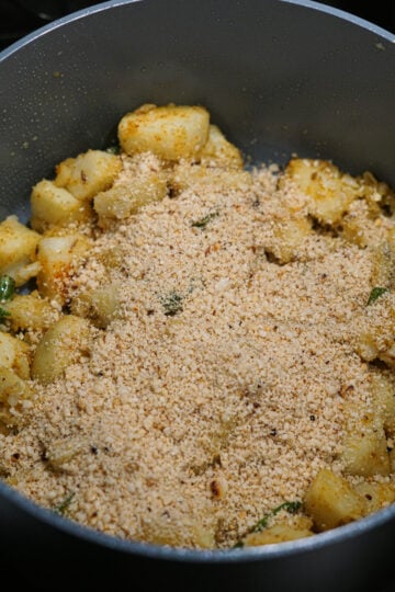 Roasted, ground peanuts added to spiced potato mixture.