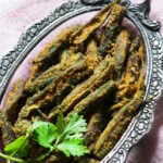 Bharela bhinda nu shaak in an oval bowl.