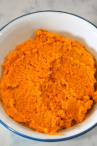 Carrot chutney ingredients blended into a smooth paste in a bowl.