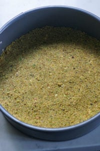 Pistachio cracker crust in a springform pan