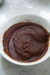 Apple butter chutney in a white bowl.