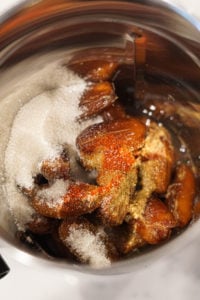 Ingredients for khajoor ki chutney (salt, sugar,dates, spices)in a blender.