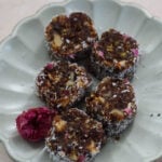 Dry fruit barfi in a fluted white plate.