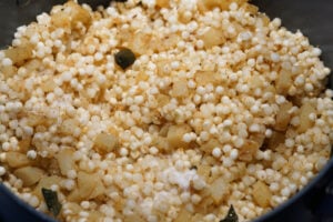 Sabudana added to the spiced potato mixture.