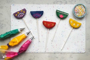 Cake pops in process of being decorated.
