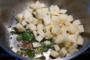 Potatoes added to the sama ki khichdi pot.