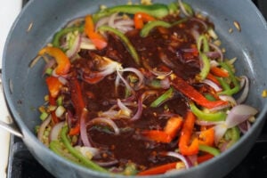 Sauce mixture added to pan