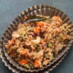 Quinoa Upma in an oblong scalloped plate.