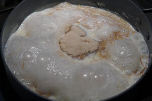 Sugar added to boiling milk.