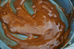 Melting jaggery in a nonstick pan.