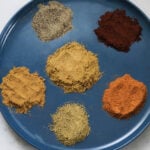 Garam masala substitute ingredients on a blue plate.