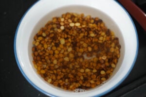 Roasted chana dal soaking in water.