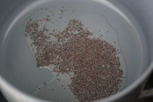 Oil heated in a pan with mustard seeds.