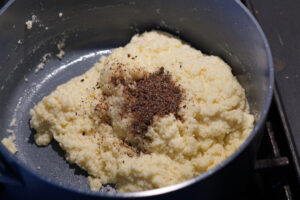 Cardamom added to peda mixture.