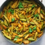 Tindora nu shaak in a pan.