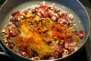 Spices added to pan.