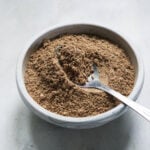 Sandwich masala in a bowl with a silver spoon.
