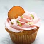 Gulab jamun cupcake with rose whipped cream frosting.