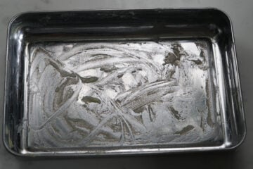 Mithai tray greased with ghee.