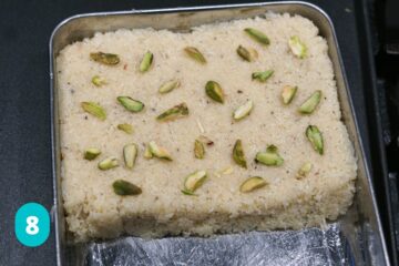 Kopra pak setting in tray with pistachio pieces.