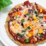 Bhakri pizza on a white plate.