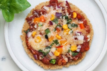 Bhakri pizza on a white plate.