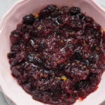 Cranberry sauce made from dried cranberries in a pink bowl.