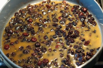 Dried cranberry sauce ingredients in a pan.