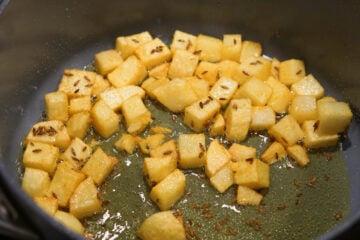 Cooked potatoes in a pot.