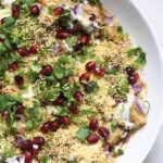 Aloo chana chaat in a white bowl.