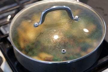 Covered pan on stovetop.
