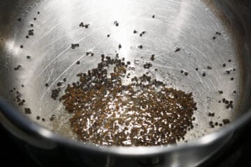 Tadka in a pan on stovetop.