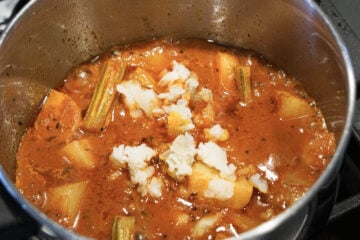 Mashed potato added to pot.