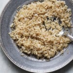 A plate of cooked brown basmati rice.