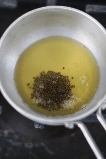 Melted ghee with mustard seeds.