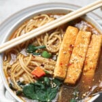 Hakka noodle soup in a bowl with chop sticks.