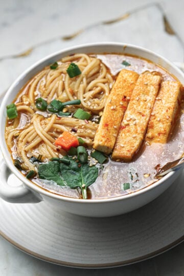 Hakka noodle soup in a soup bowl.