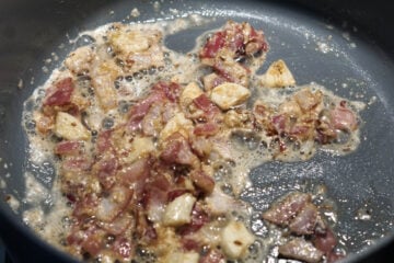 Garlic and ginger added to pan.