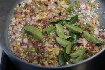 Curry leaves added to pot.