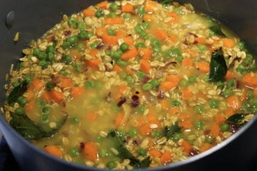 Oats and water added to pot.