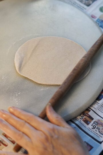 Rolled out circle dough.