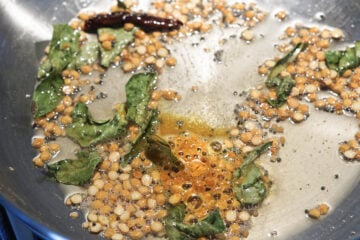 Turmeric powder added to the pan.