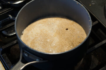 Milk added to pan.