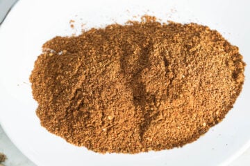 Homemade tandoori masala powder in a white plate.