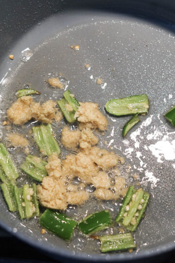 Ginger added to pan with oil and green chilies.