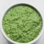 Green chili paste in a gray bowl.